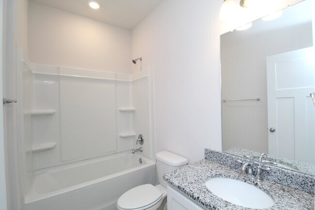 Building Photo - Don’t Miss This 4BR Home — 3-Car Garage, Modern Interior, Open Layout & Community Pool in Prime 9...