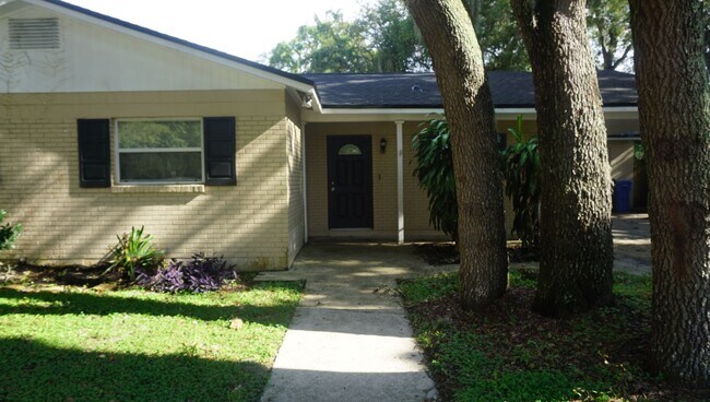 Building Photo - Four Bed - Three Bath - Large Storage Area...