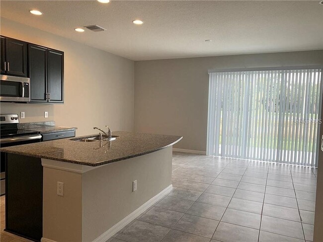 Building Photo - 7042 Grand Elm Dr