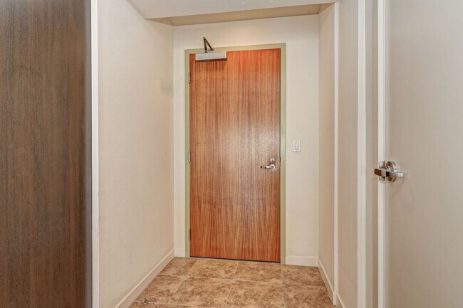 Building Photo - Modern Downtown Condo in Premier High-Rise...