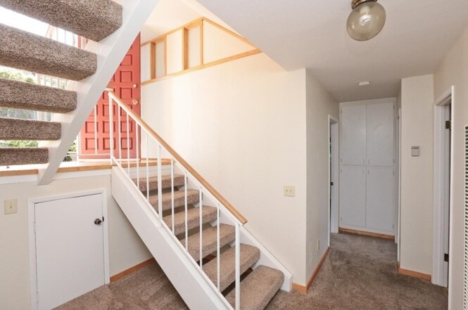 Stairs from the entryway to the living area - 3755 Faye dr