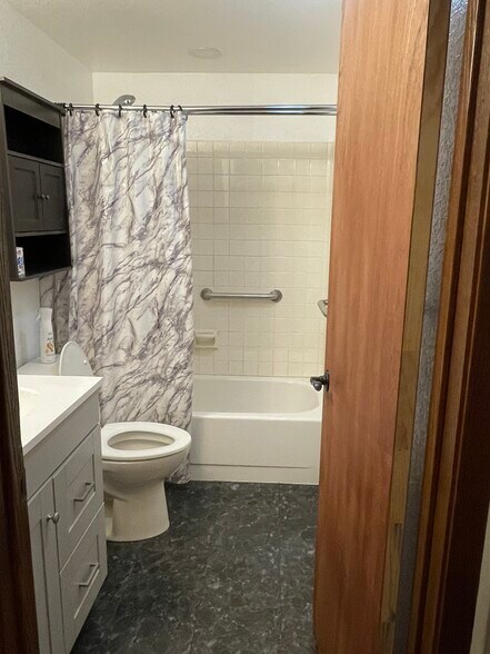Bathroom equipped with handicap rails and plenty of storage space - 240 W Kyle Dr