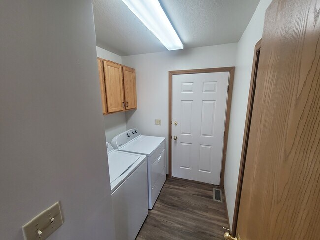 Laundry and door to garage - 113 W Meade Ave