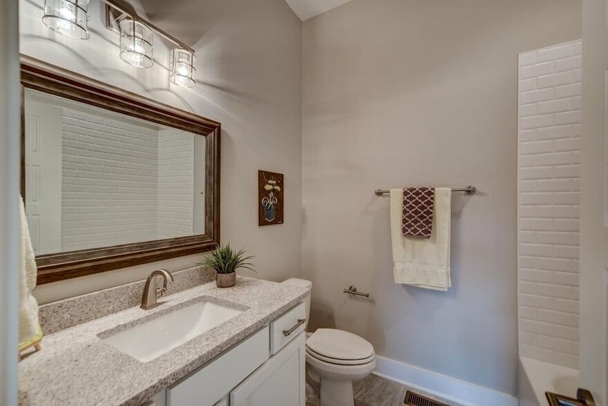 Modern and open white bathrooms - 910 Sharpe Ave