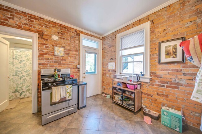 Building Photo - Charming 5-Bedroom Home with Exposed Brick and Modern Upgrades