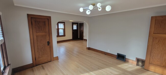 Refinished original Flooring and new light fixtures - 2410 N 65th St