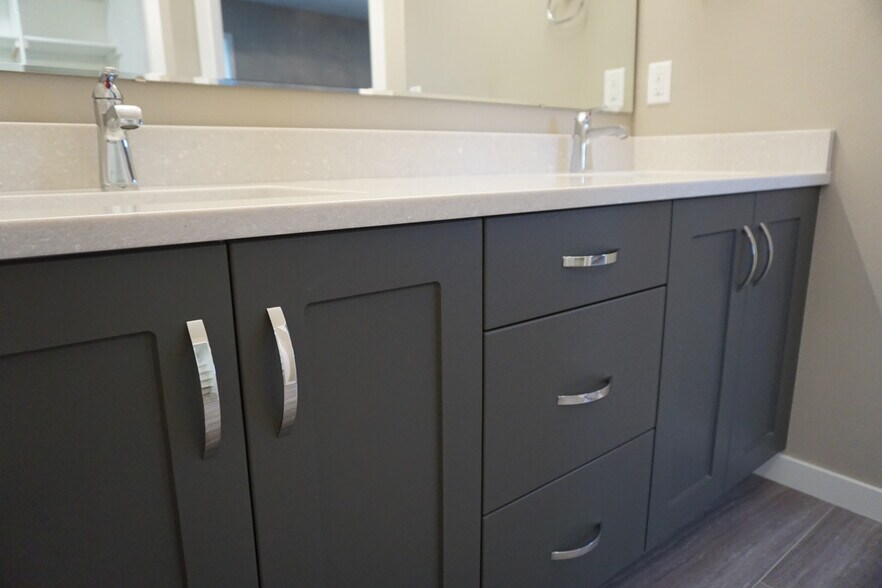 Master bath quartz countertops (Photos are of similar unit with similar finishes.) - 3811 Stacy Drive