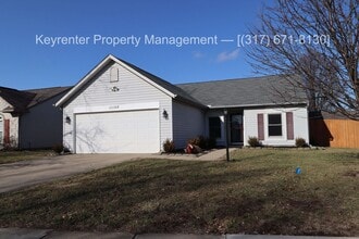 Building Photo - Discover this well-maintained 3-bedroom, 2-bath home in Indianapolis featuring an attached garage...