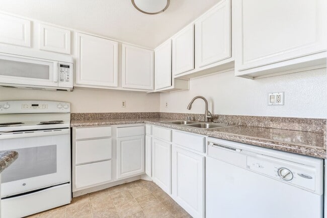 Building Photo - Guard-Gated Condo Living with Resort-Style Community Amenities!