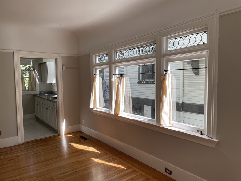 original decorative glass and wall of windows in living room - 568 Merrimac St