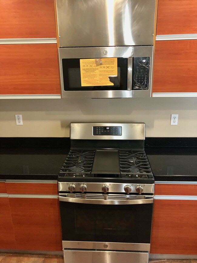 New stove and over the range microwave - 9254 Elm Vista Dr