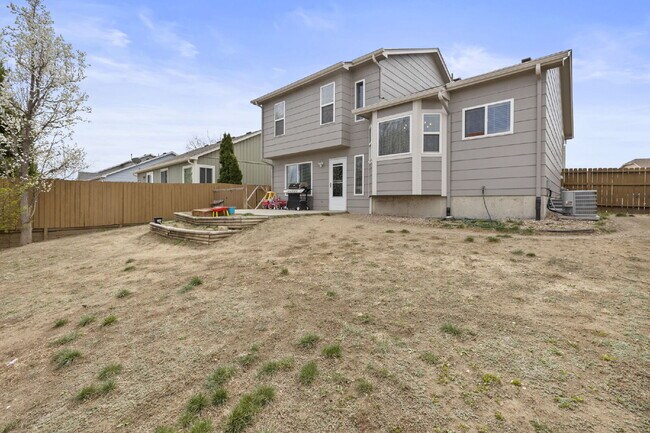 Building Photo - Spacious 4-Bedroom Home with Fenced Yard, 2-Car Garage & Scenic Views in Cheyenne Meadows