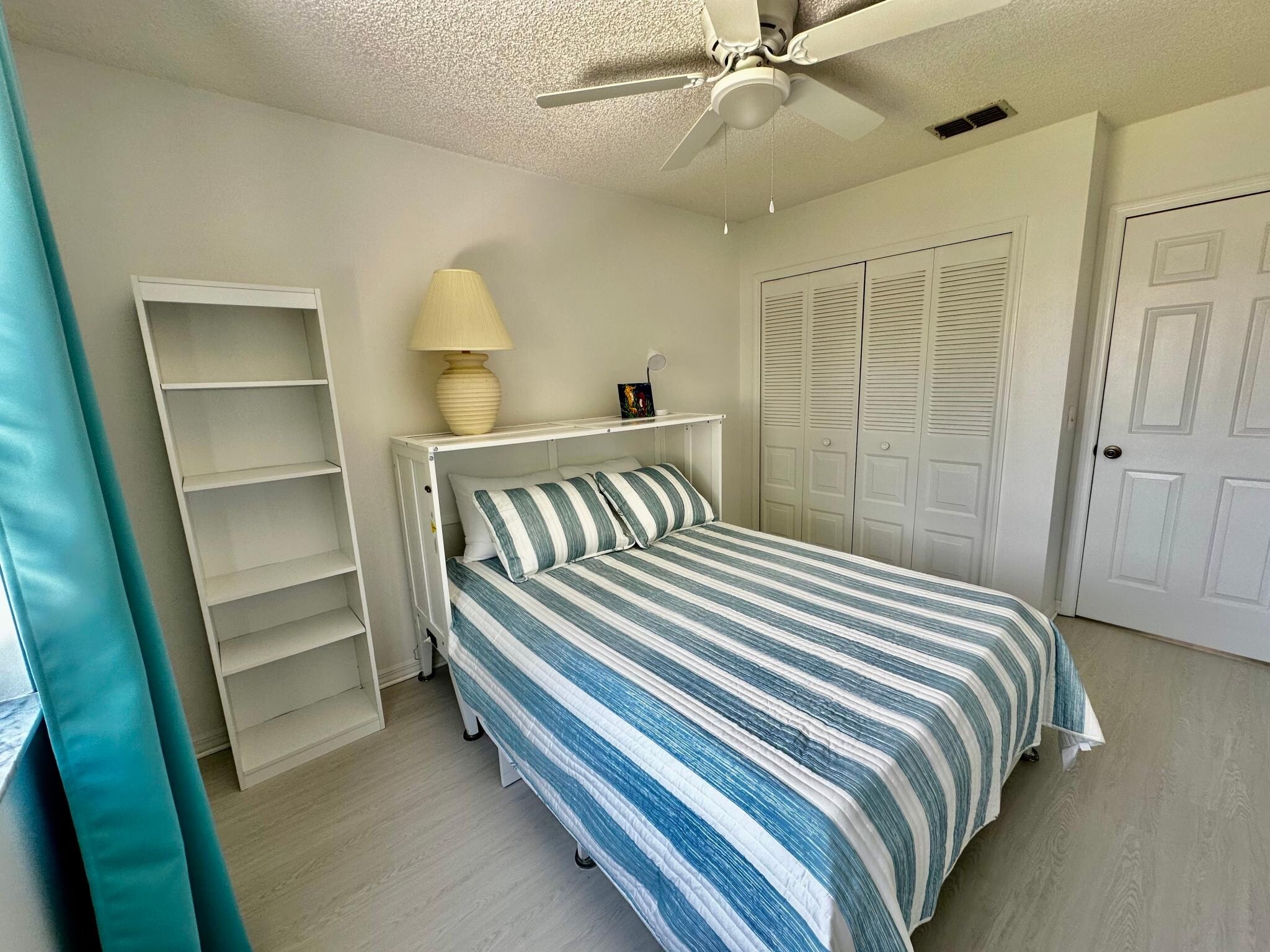 Guest bedroom with Queen Murphy bed folded out - 174 Maritime Pl