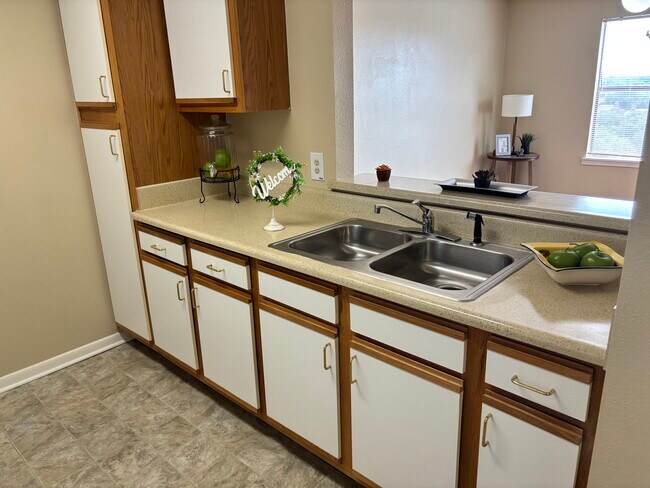 Kitchen open to living space. - Nueces Bend Senior Housing