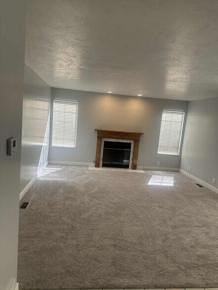 Family room with fireplace - 9228 S Stone Point Pl