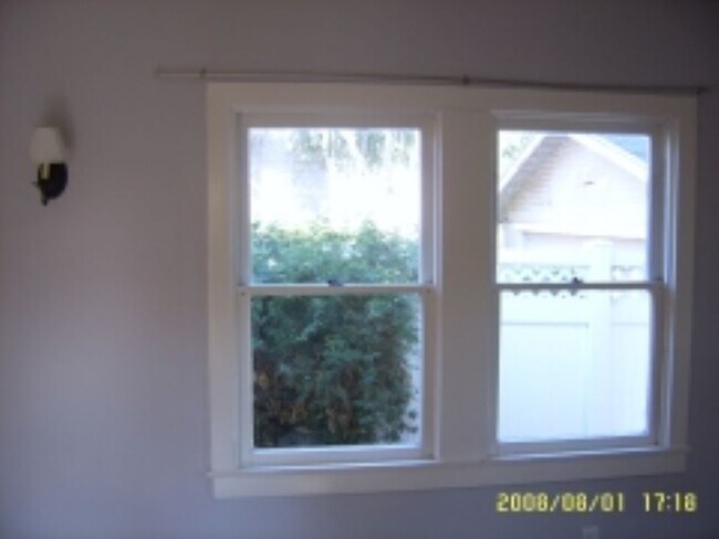 16.2 Primary Bedroom- windows across from French doors - 680 Highland St