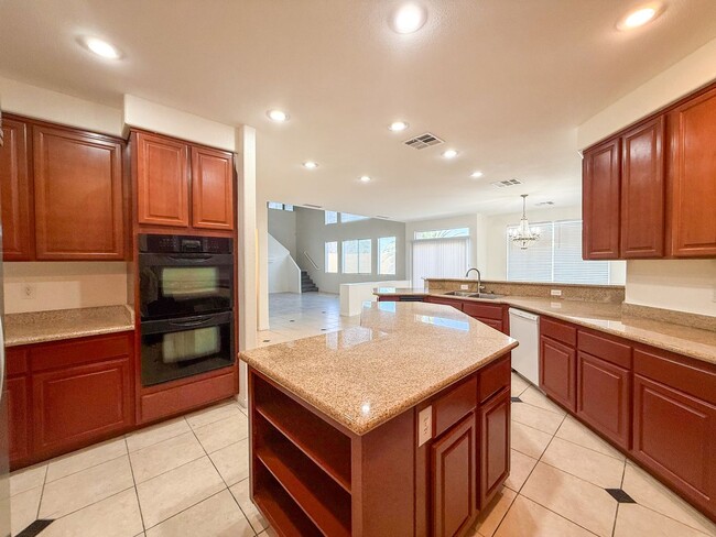 Building Photo - SPACIOUS HOME IN GATED COMMUNITY WITH POOL, RV PARKING & 4-CAR GARAGE!