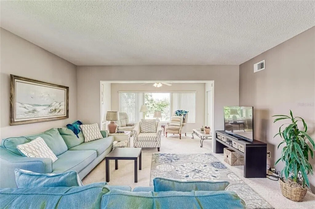 Living room looking towards Florida room [Unit is unfurnished] - 2460 Franciscan Dr