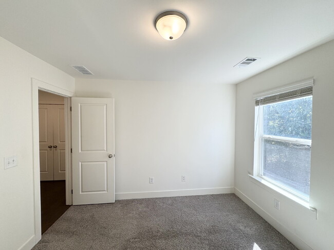 Building Photo - Stylish 3BR Townhome with Private Yard & T...