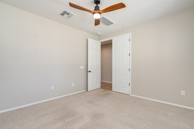 Building Photo - Amazing 4BR 2.5BA Home w/ 3-Car Tandem Garage • Pool Access • Yard w/ Fire Pit in Saguaro Trails