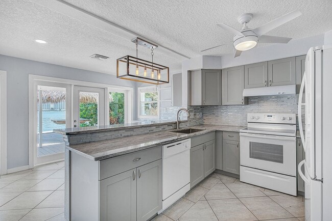 Building Photo - Waterfront 3BR/2BA Home – Walk to Beach + Boat Lift – $500 Off!