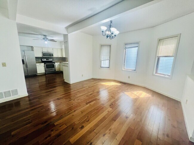 Building Photo - "Spacious 5-Bedroom Retreat with Elegant Hardwood Floors in Vibrant Minneapolis Neighborhood!"