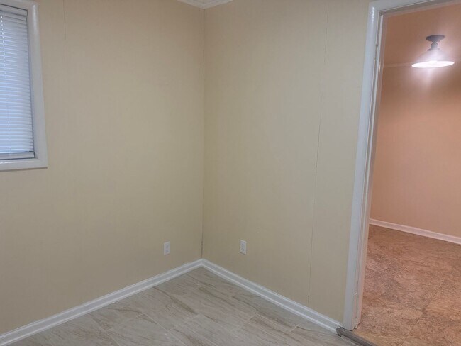 Building Photo - Step into this beautifully updated 1950's gem, where charm meets modern convenience