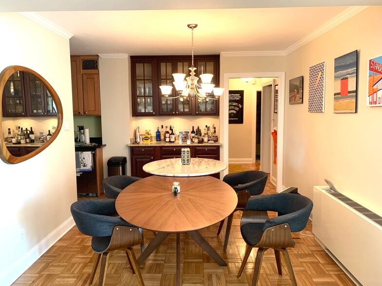 Dining room next to kitchen with corridor to bathroom/bedroom - 2475 Virginia Ave NW