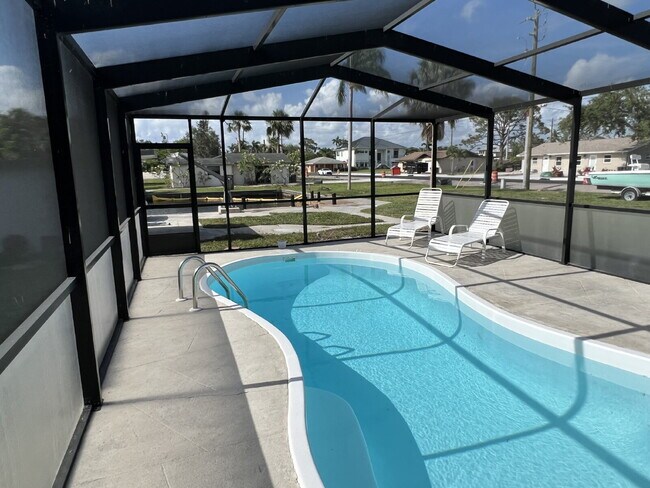 Building Photo - "Charming 2-Bed Retreat Waterfront W/Pool ...