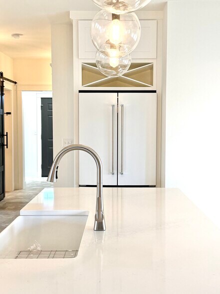 Kitchen, fridge, wine rack above fridge - 24 Ash St N