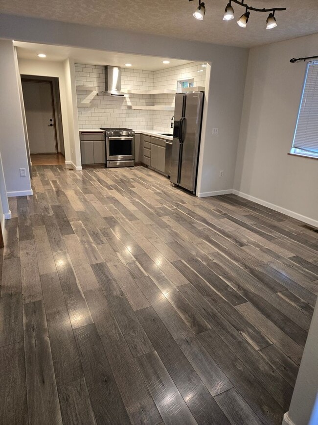 Building Photo - Large lot with tons of storage !  3 br , 2 bth + office+ 2  Car-garage + 2 Wooden Sheds