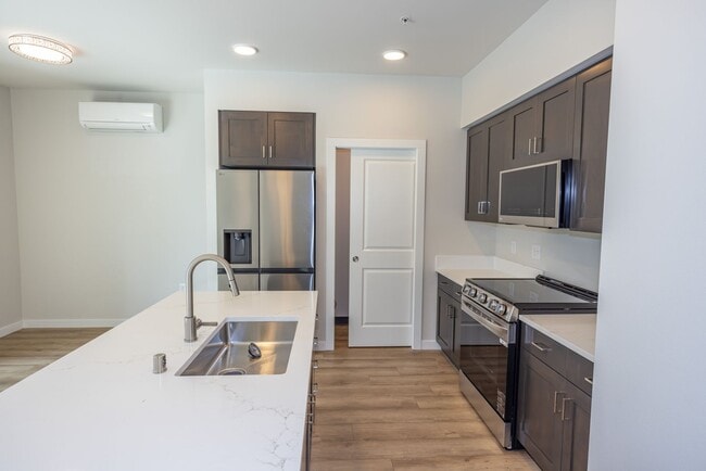 Building Photo - BRAND NEW - Reserve Street Lofts - Gated - Ground floor unit / ADA features