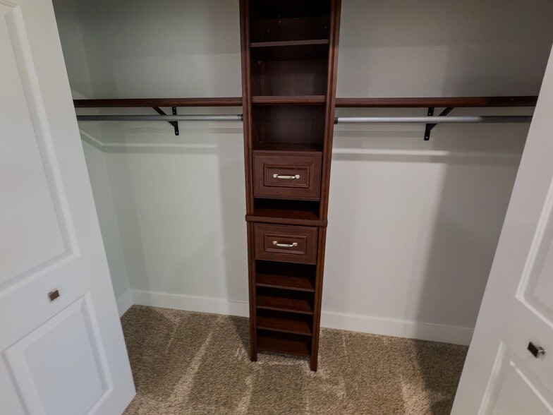 Large closet with custom built-in organizer, drawers, and hanging rods - 2006 Candle Ct