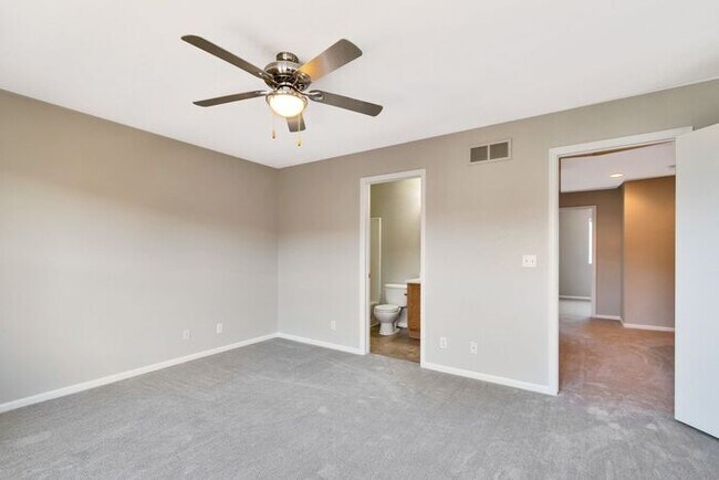 Building Photo - 3BR Townhome Near DIA & Light Rail | New Carpet, Garage & Fenced Patio