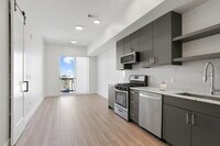 Building Photo - Luxe Condo Near Regis With Covered Parking Included