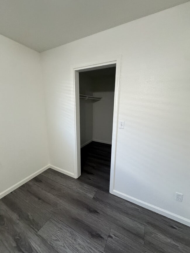 Building Photo - 4-bedroom, 2-bath home with solar, featuring a huge backyard and low-maintenance landscaping with...