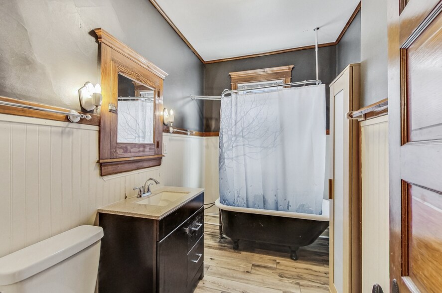 Recently updated bathroom with new vanity, sink, and floors - 3747 N Kostner Ave