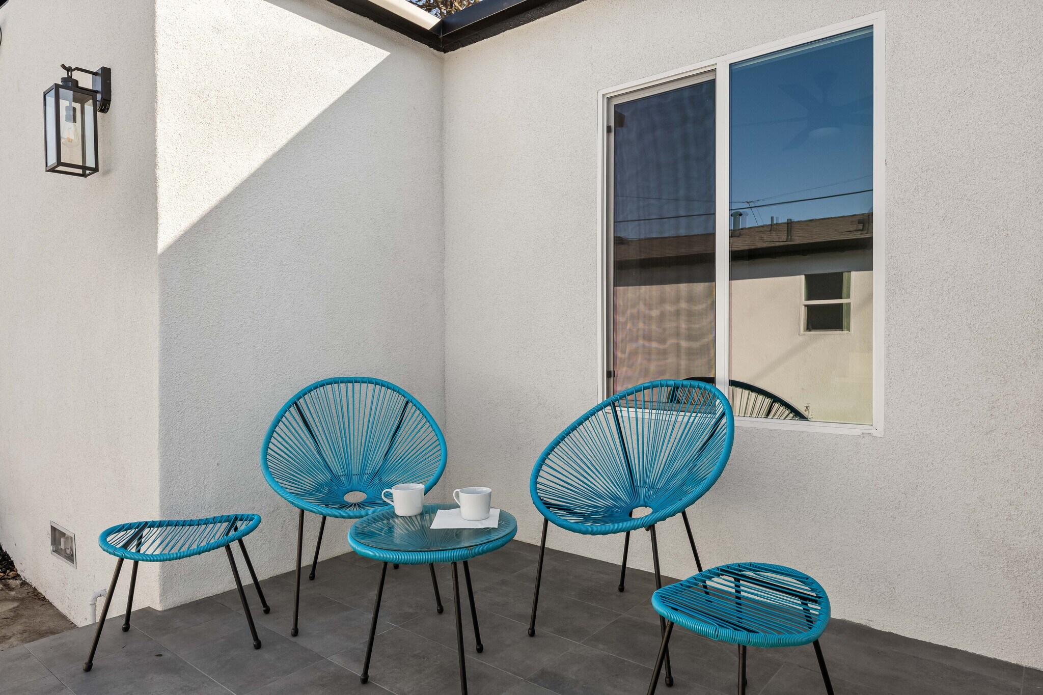 Private outdoor space behind the house for enjoying coffee and the natural sunlight. - 1823 N Ditman Ave