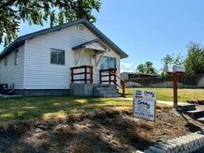 Building Photo - For Rent: 2 Bedroom, 1 Bathroom Home with Garage and Large Yard