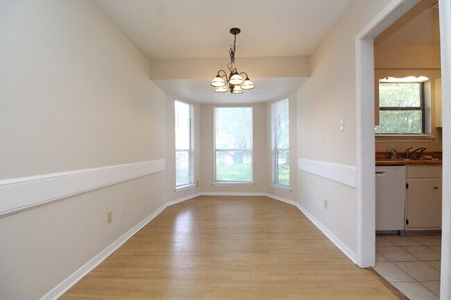 Building Photo - 2BR Home with Wood-Look Flooring, Fenced Backyard & Private Patio
