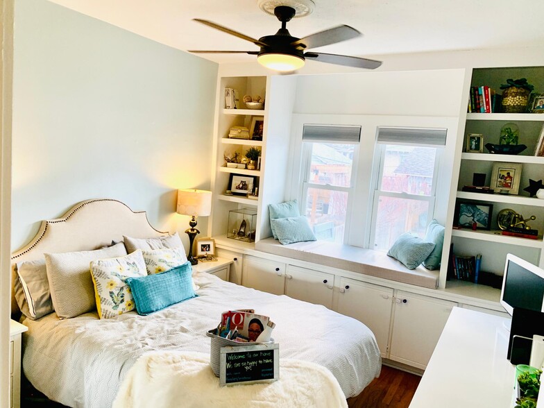 Bedroom with gorgeous built-in shelving overlooking the beautiful backyard. - 1447 Osceola St