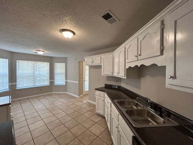 Building Photo - Spacious 3BR/2BA Lake Community Home | Soaring High Ceilings, Fireplace & 2-Car Garage