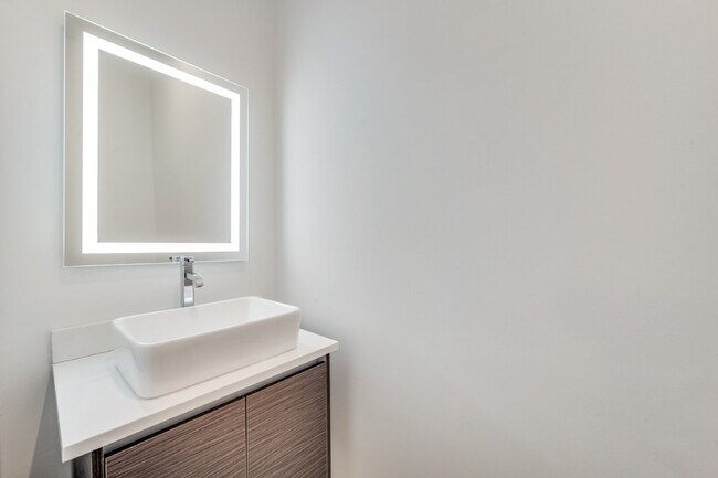 Building Photo - Live Above It All | Sleek Multi-Level Condo with Private Rooftop Deck