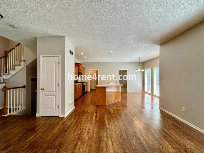 Building Photo - Beautiful Four-Bedroom Home with Three Car Garage, Wood Floors, Finished Basement and a Fenced Ya...