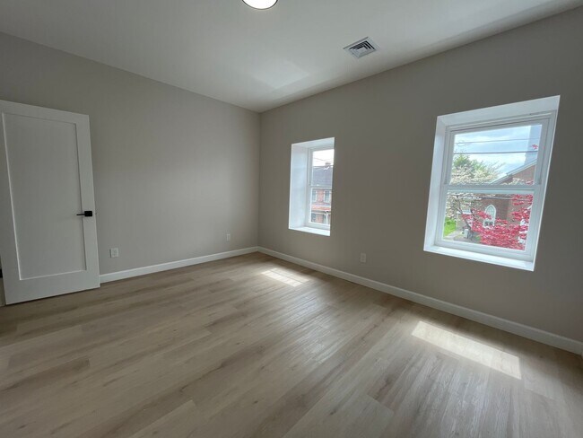 Building Photo - A real stunner! The full renovation is the first thing you'll notice..