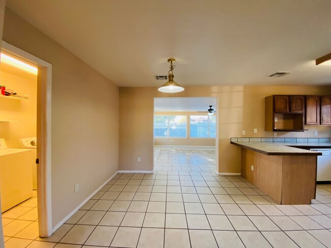 Building Photo - 4/2 Home with a backyard!
