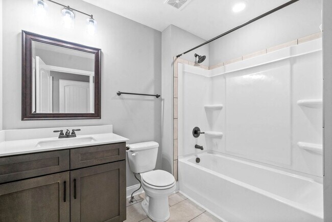 Building Photo - Pet Friendly Three Bedroom with Bonus!