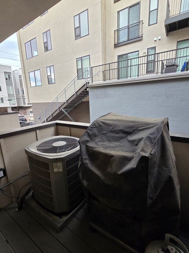 Building Photo - STUNNING 4-LEVEL TOWNHOME IN HIGHLANDS WITH SAUNA, 2-CAR GARAGE + AMAZING ROOFTOP DECK!