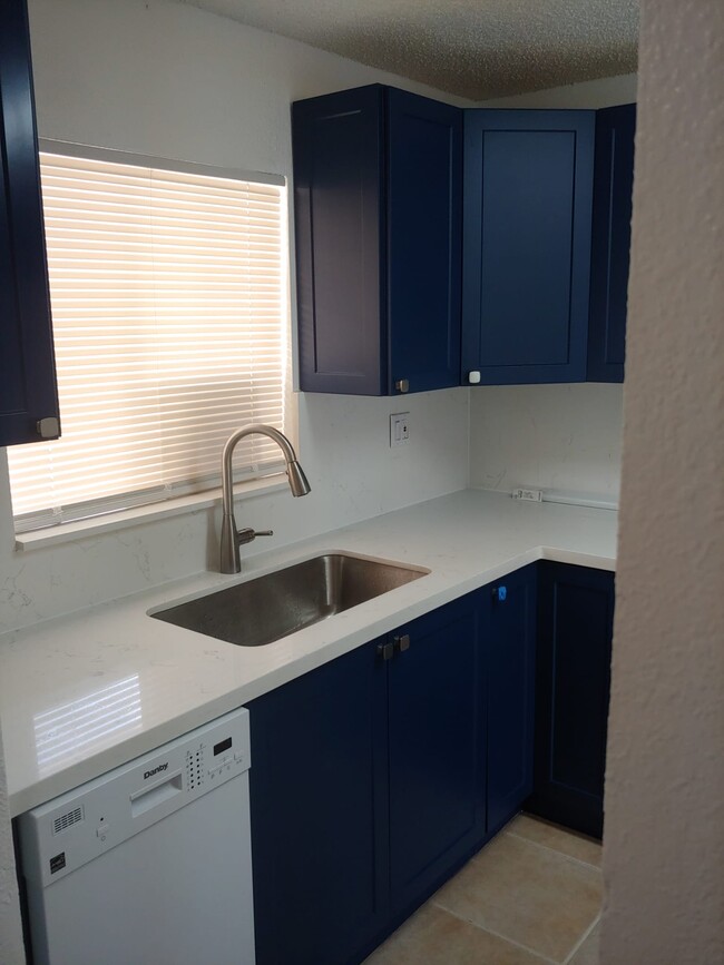 Kitchen viewed from entrance hallway - 6130 W 21st Ct