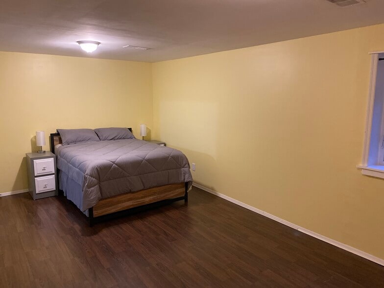 Tall queen size bed and two nightstands, with touch sensitive lamps. - 8371 Stationhouse Ct